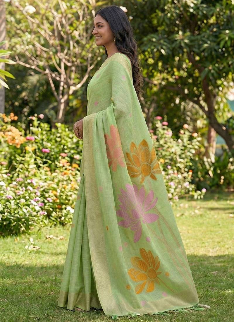 Pastel green linen cotton blend saree with floral woven pallu & zari border