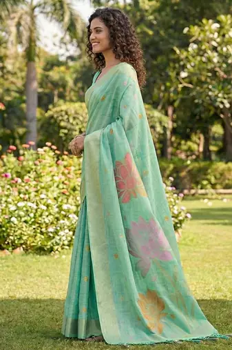 Sea green linen cotton blend saree with floral woven pallu & zari border