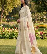 Off white linen cotton blend saree with floral woven pallu & zari border