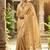 Beige silk blend saree with silver zari horse motif