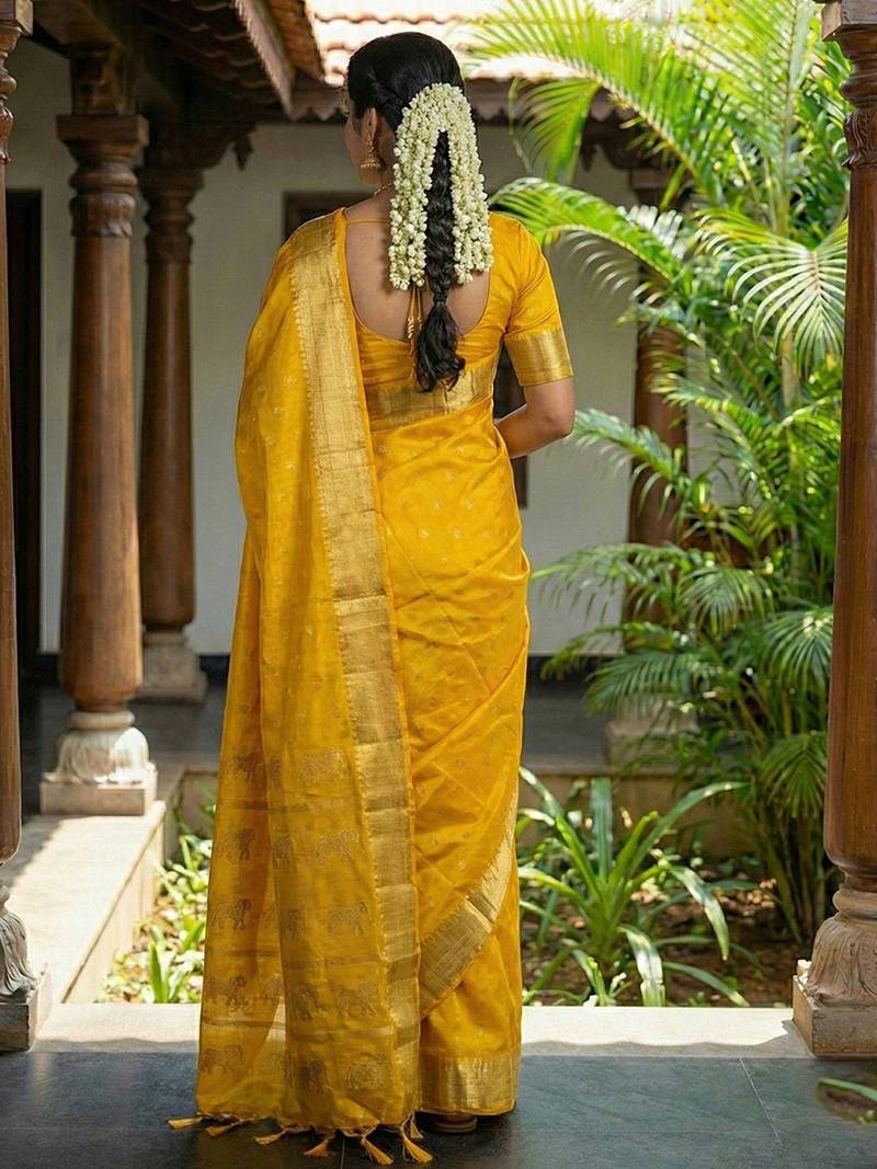 Mustard silk blend saree with silver zari horse motif