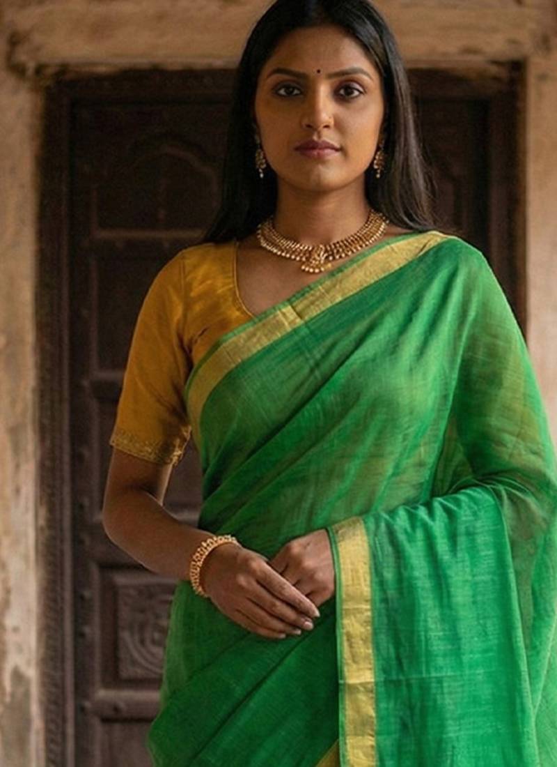 Green cotton silk blend saree with contrasting border