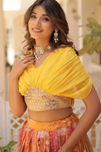Orange silk blend Free Size Stitched Lehenga Choli with Foil Embroidery & Printed Work