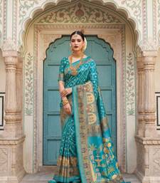 Teal Color Printed Pallu With Body Print Jacquard Weaving Border Dola Silk Saree