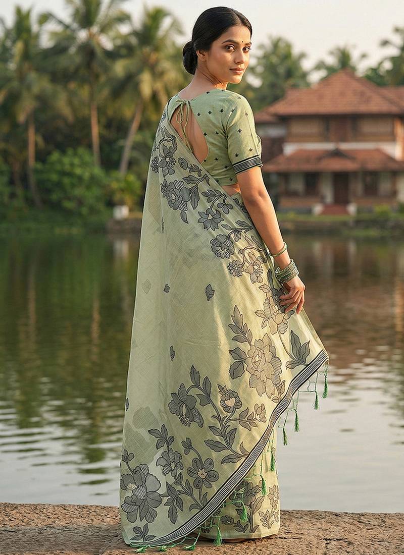 Mint green floral printed linen blend saree with matching blouse piece