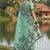 Sea green floral printed linen blend saree with matching blouse piece