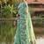 Sea green floral printed linen blend saree with matching blouse piece
