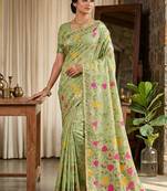 Light green linen cotton blend saree with floral print