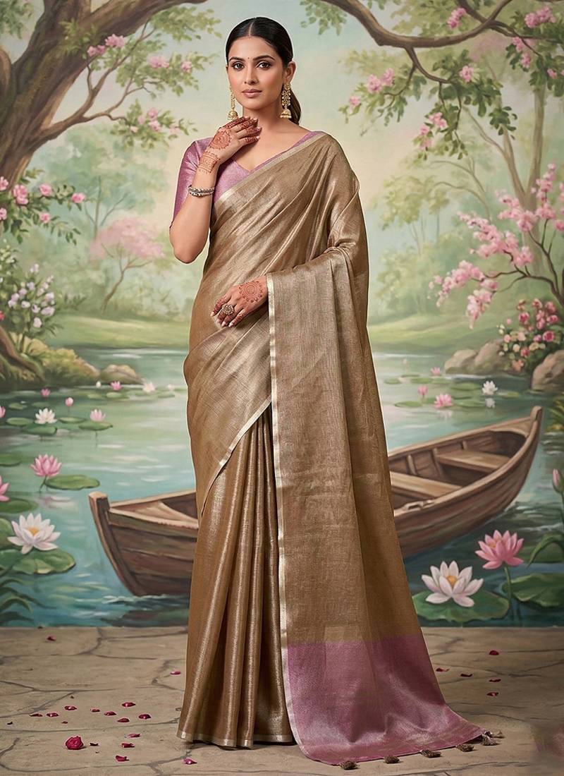 Chiku tissue linen blend saree with onion pink  contrast blouse
