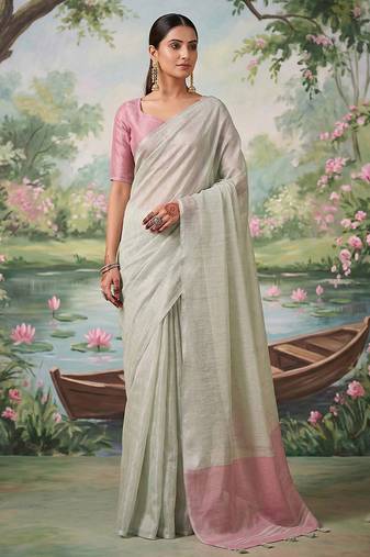 Off white tissue linen blend saree with pink contrast blouse