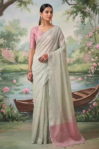 Off white tissue linen blend saree with pink contrast blouse