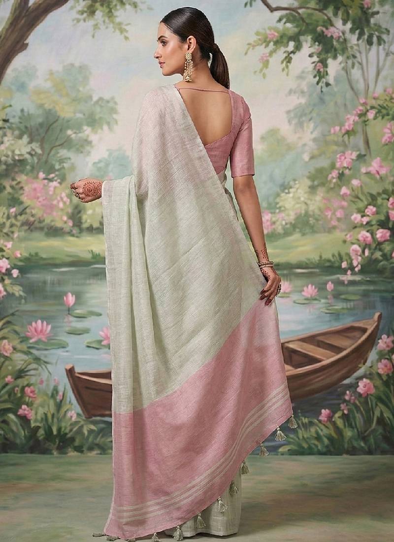 Off white tissue linen blend saree with pink contrast blouse