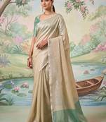 Beige tissue linen blend saree with sea green contrast blouse