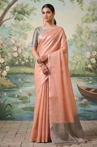 Peach tissue linen blend saree with grey contrast blouse