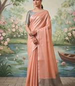 Peach tissue linen blend saree with grey contrast blouse
