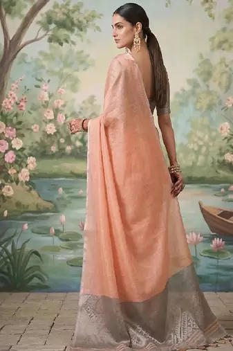 Peach tissue linen blend saree with grey contrast blouse