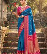 Royal blue banarasi silk blend saree with rani pink zari border
