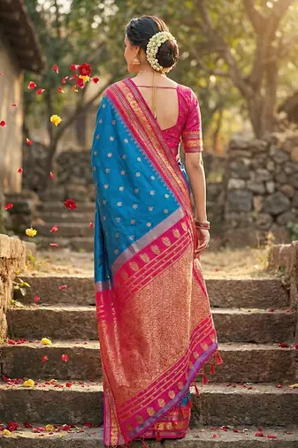 Royal blue banarasi silk blend saree with rani pink zari border