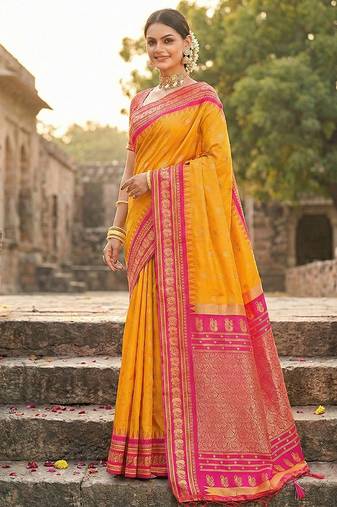 Mustard banarasi silk blend saree with rani pink zari border