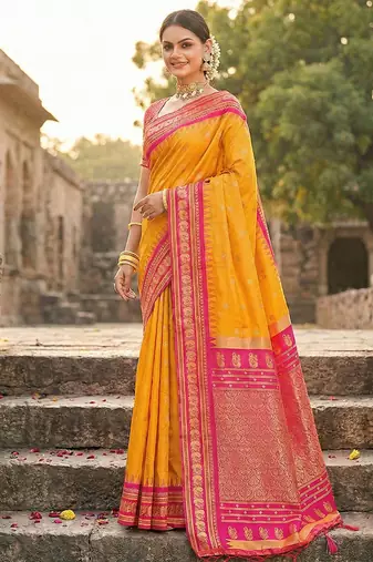 Mustard banarasi silk blend saree with rani pink zari border