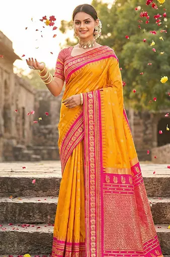 Mustard banarasi silk blend saree with rani pink zari border