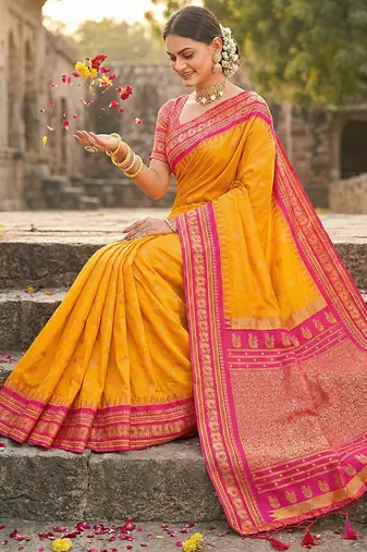Mustard banarasi silk blend saree with rani pink zari border