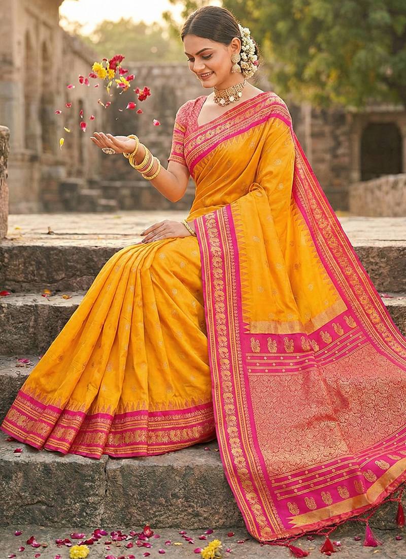 Mustard banarasi silk blend saree with rani pink zari border
