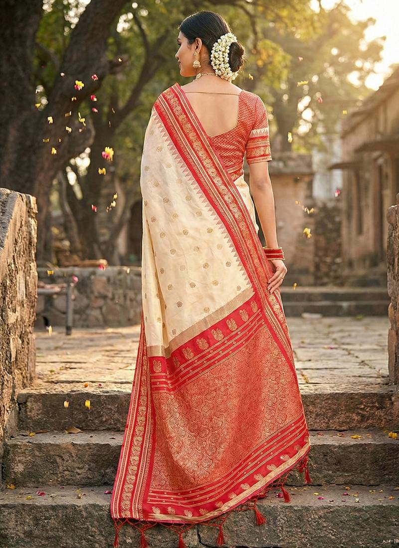 Off white banarasi silk blend saree with red zari border