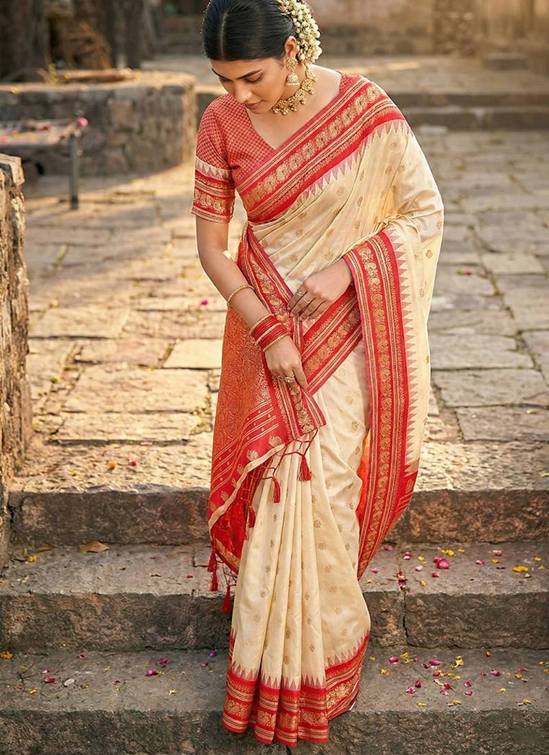 Off white banarasi silk blend saree with red zari border