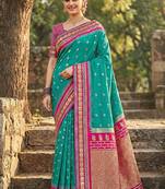 Sea green banarasi silk blend saree with magenta pink zari border