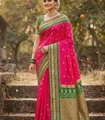 Rani pink banarasi silk blend saree with green zari border