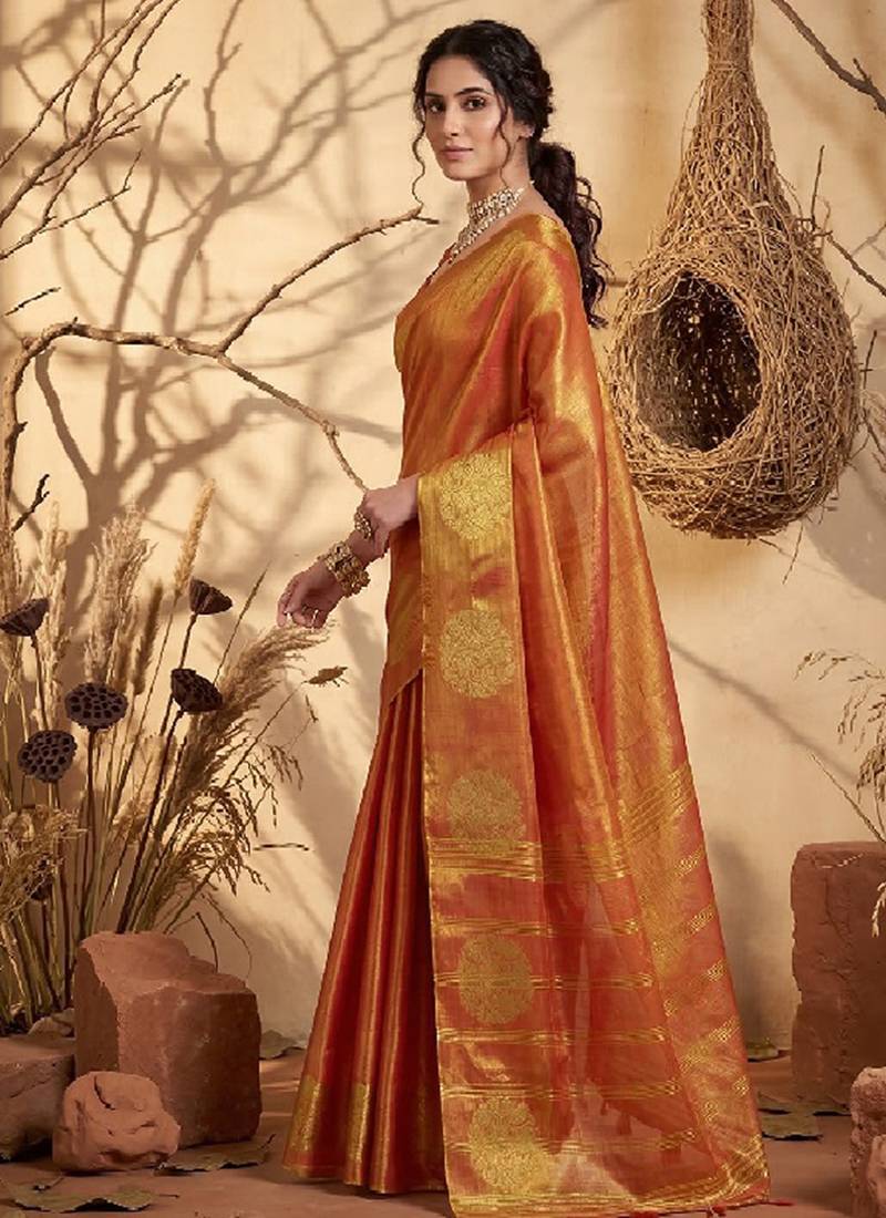Rust orange linen silk blend saree with gold zari bootas