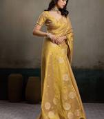 Gold linen silk blend saree with gold zari bootas and tassels