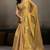 Gold linen silk blend saree with gold zari bootas and tassels