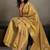 Gold linen silk blend saree with gold zari bootas and tassels