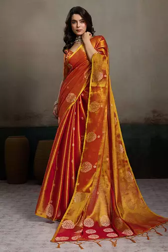 Rust orange linen silk blend saree with gold zari bootas and tassels
