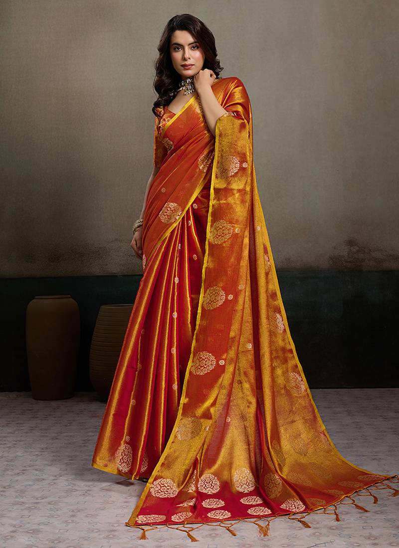Rust orange linen silk blend saree with gold zari bootas and tassels