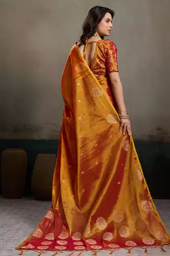 Rust orange linen silk blend saree with gold zari bootas and tassels