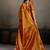 Rust orange linen silk blend saree with gold zari bootas and tassels