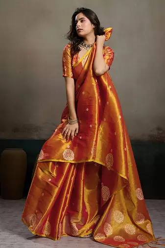 Rust orange linen silk blend saree with gold zari bootas and tassels