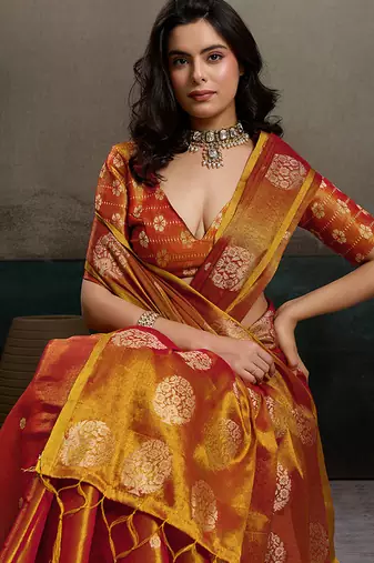 Rust orange linen silk blend saree with gold zari bootas and tassels