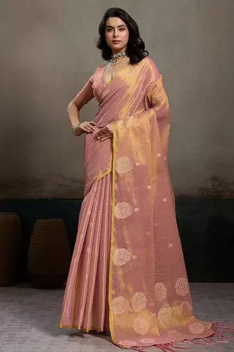Light peach linen silk blend saree with gold zari bootas and tassels