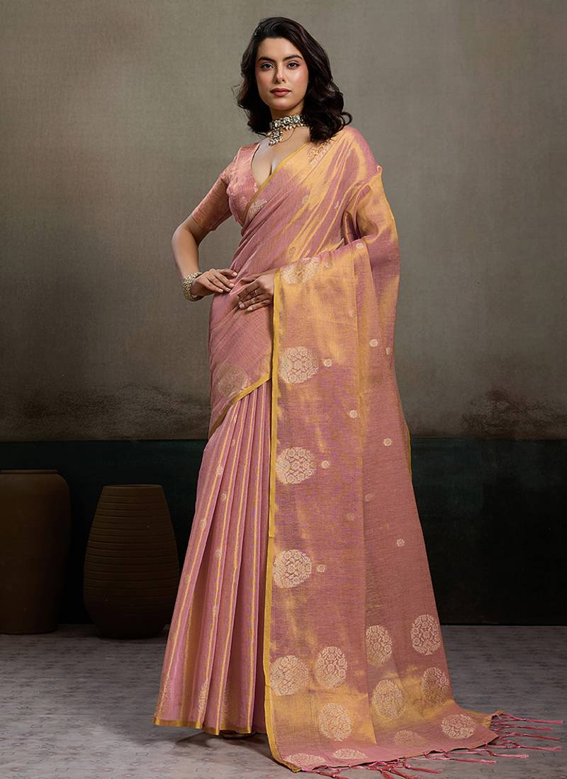 Light peach linen silk blend saree with gold zari bootas and tassels