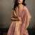 Light peach linen silk blend saree with gold zari bootas and tassels