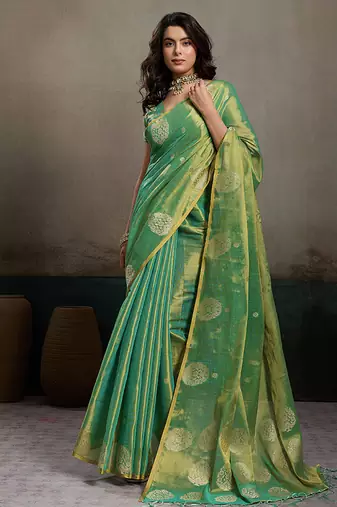 Sea green linen silk blend saree with gold zari bootas and tassels