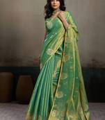 Sea green linen silk blend saree with gold zari bootas and tassels