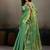 Sea green linen silk blend saree with gold zari bootas and tassels