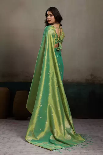 Sea green linen silk blend saree with gold zari bootas and tassels
