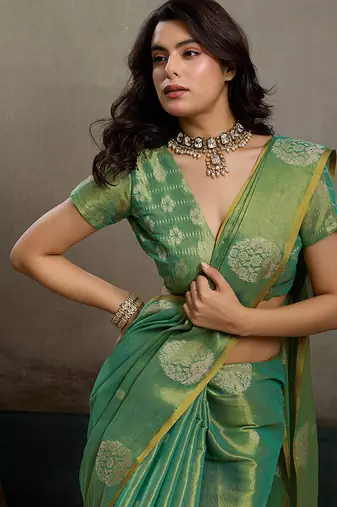 Sea green linen silk blend saree with gold zari bootas and tassels