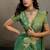 Sea green linen silk blend saree with gold zari bootas and tassels